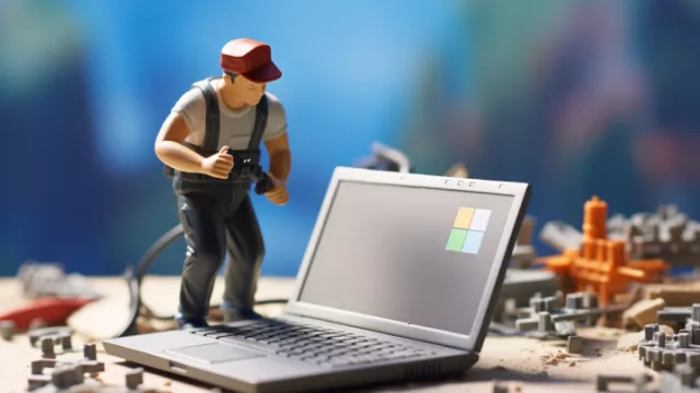 Muž pracuje na laptopu s Microsoft Windows